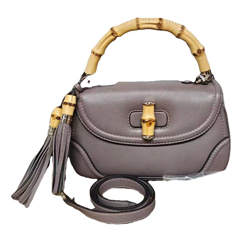 Convertible Pompon Bamboo Top Handle leather handbag
