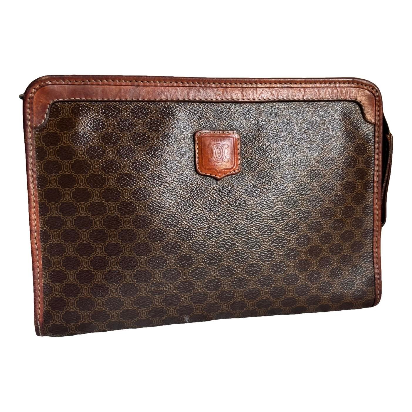 Triomphe Vintage leather clutch bag