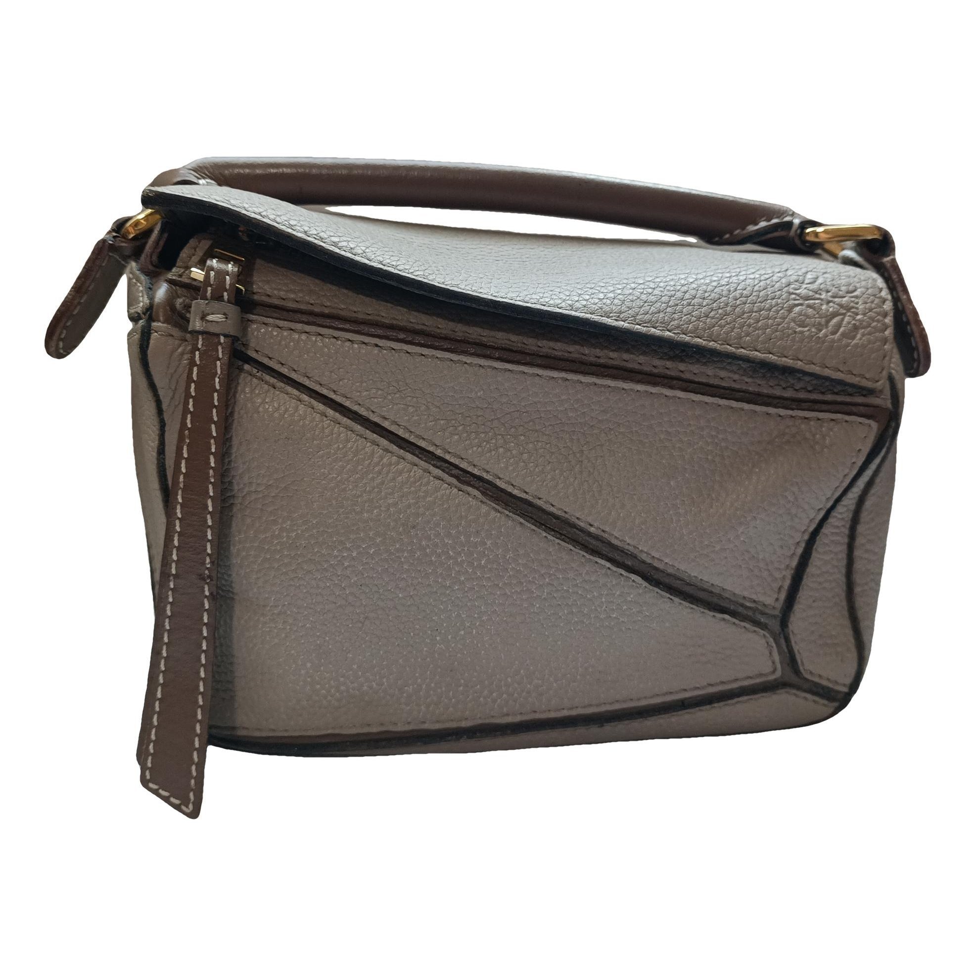 Puzzle leather handbag