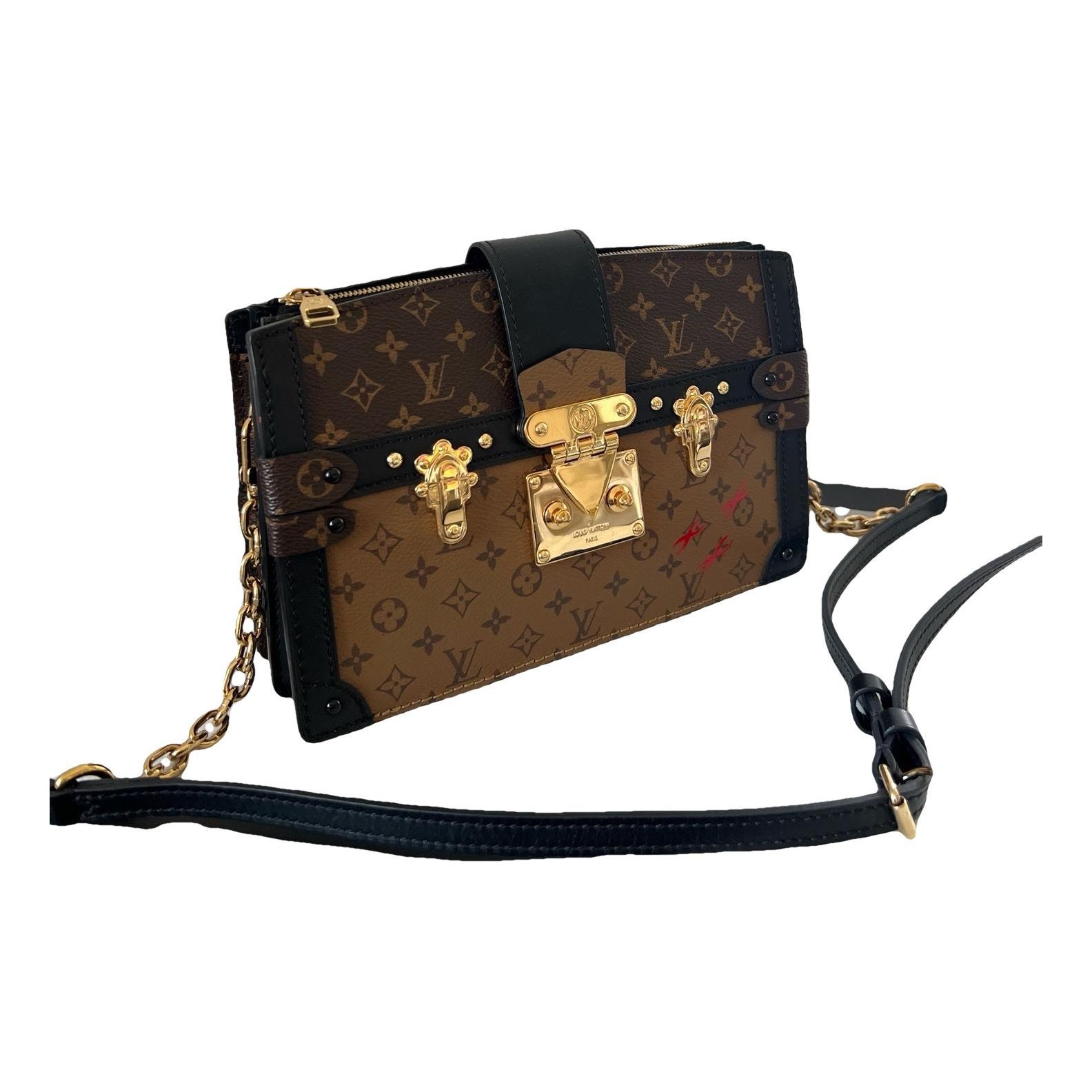 Pochette Trunk leather handbag