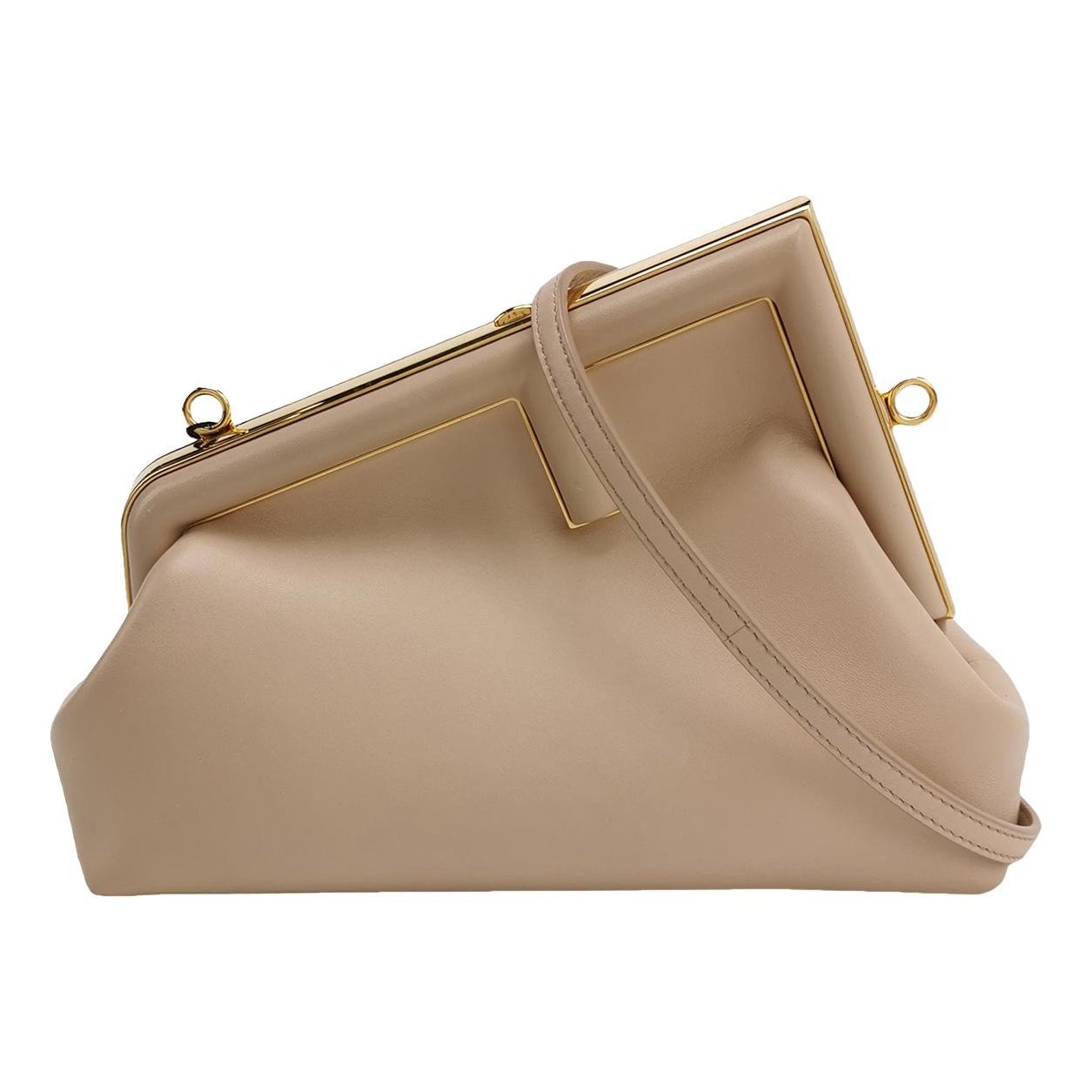 First leather handbag