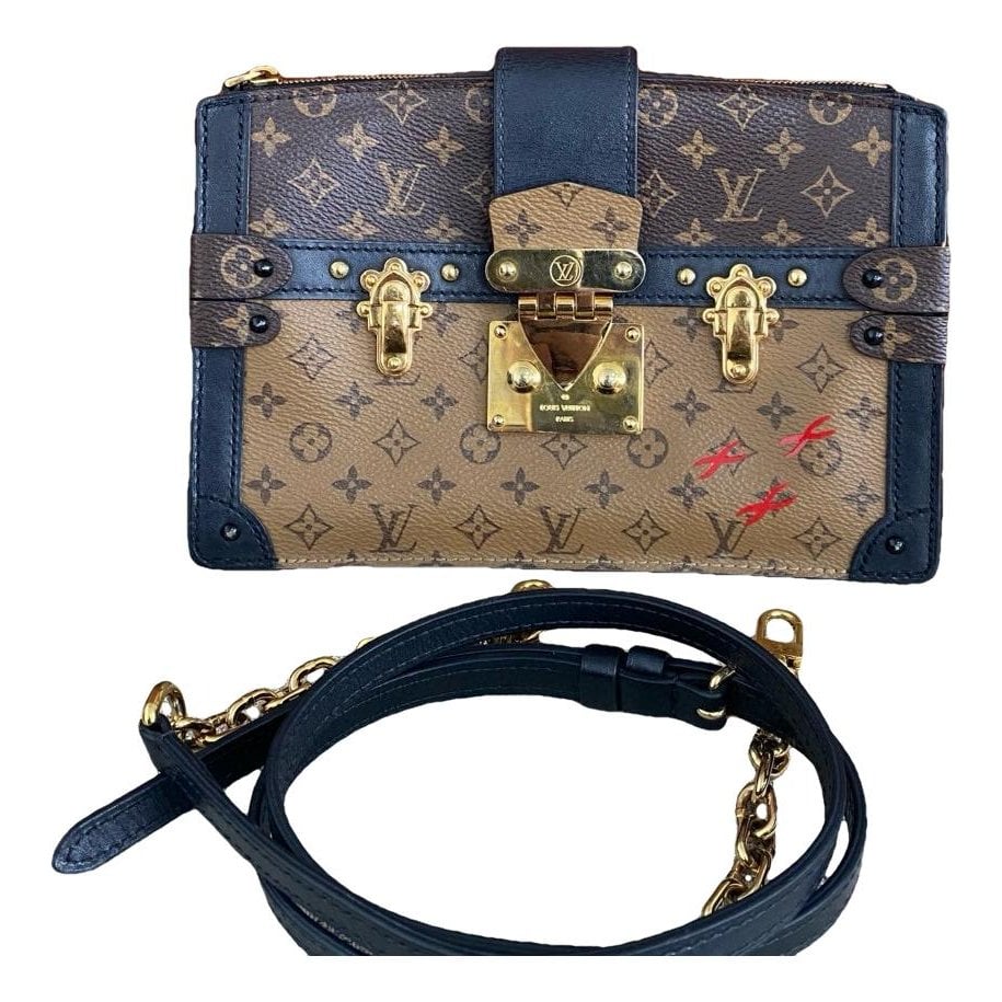Pochette Trunk leather handbag