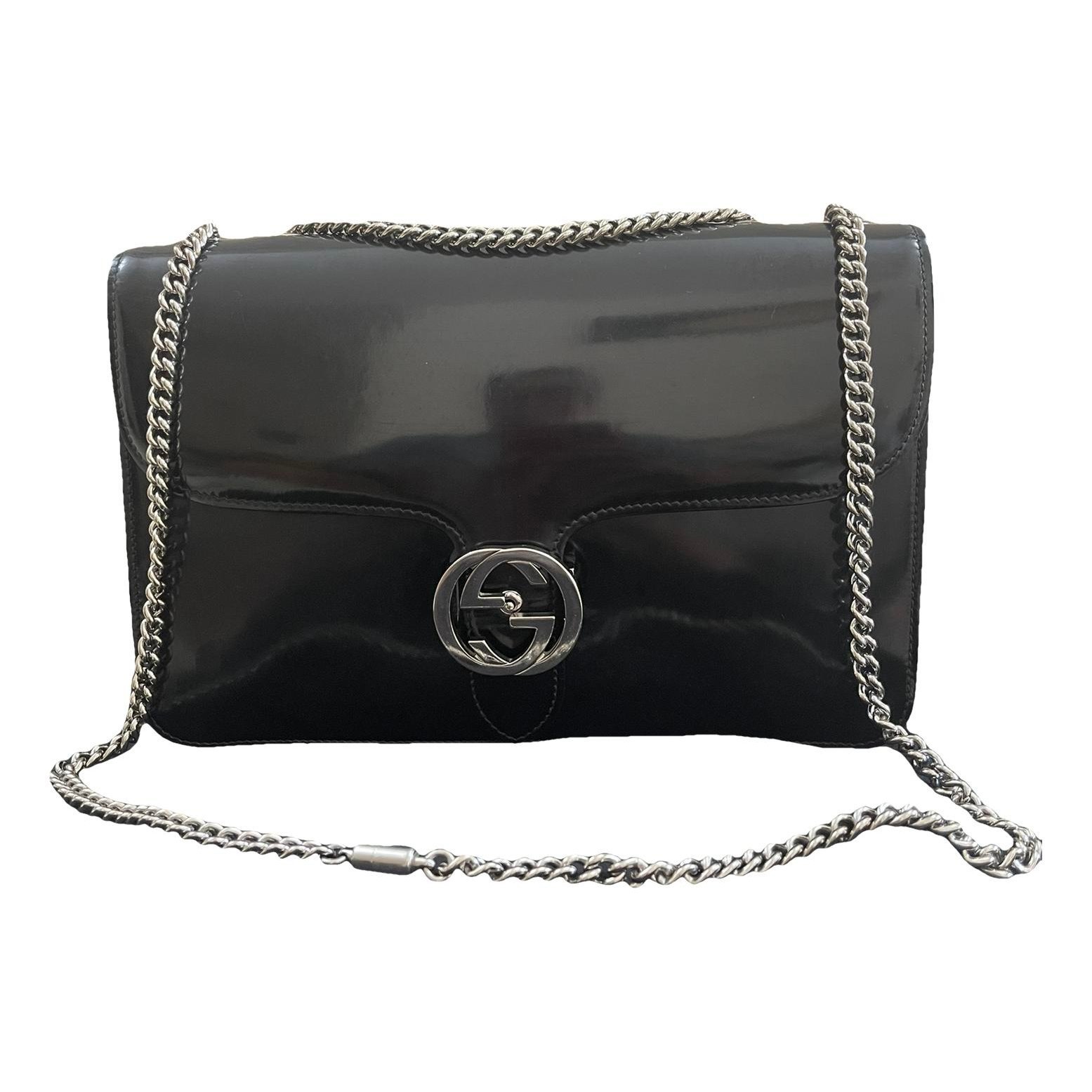 Interlocking patent leather handbag