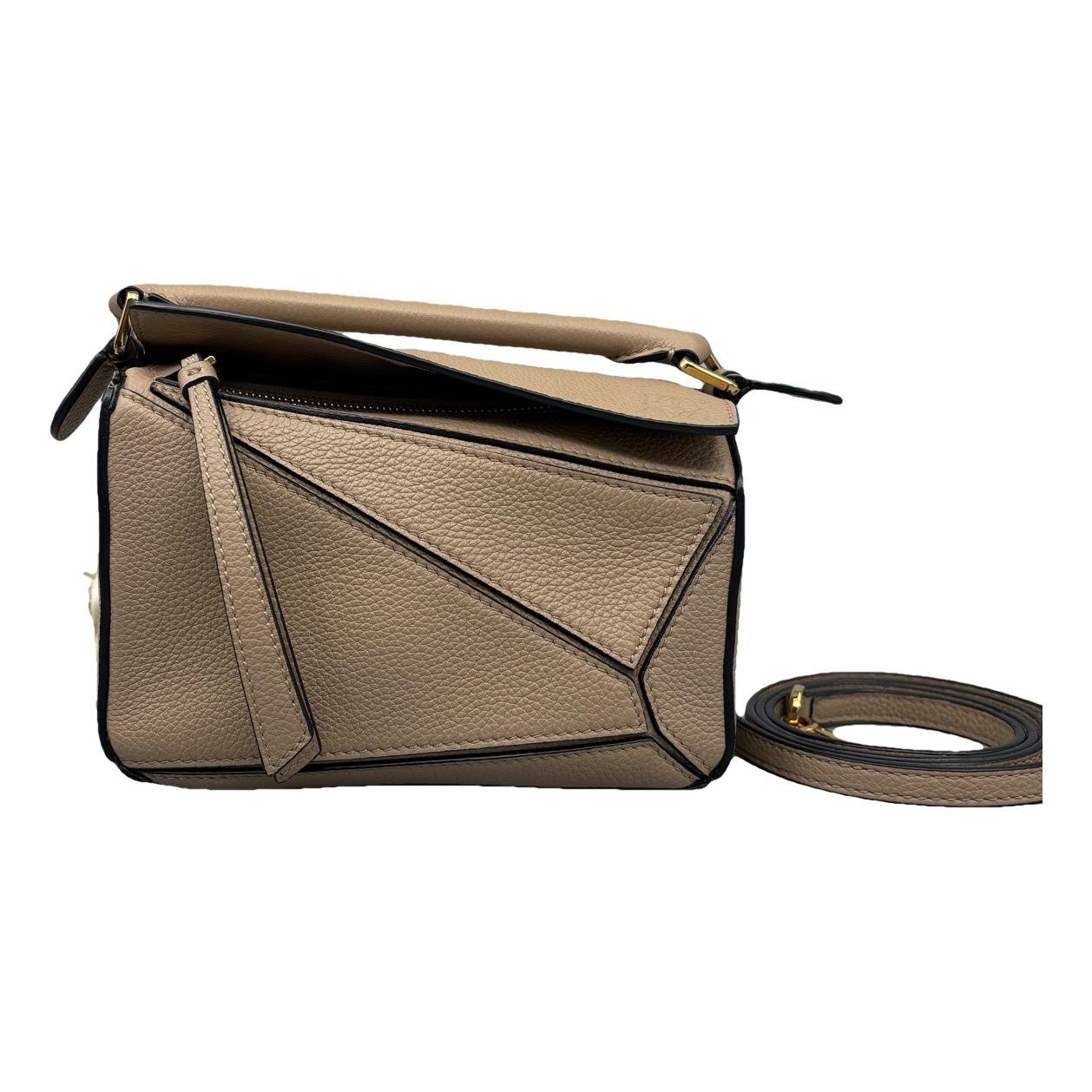 Puzzle leather handbag