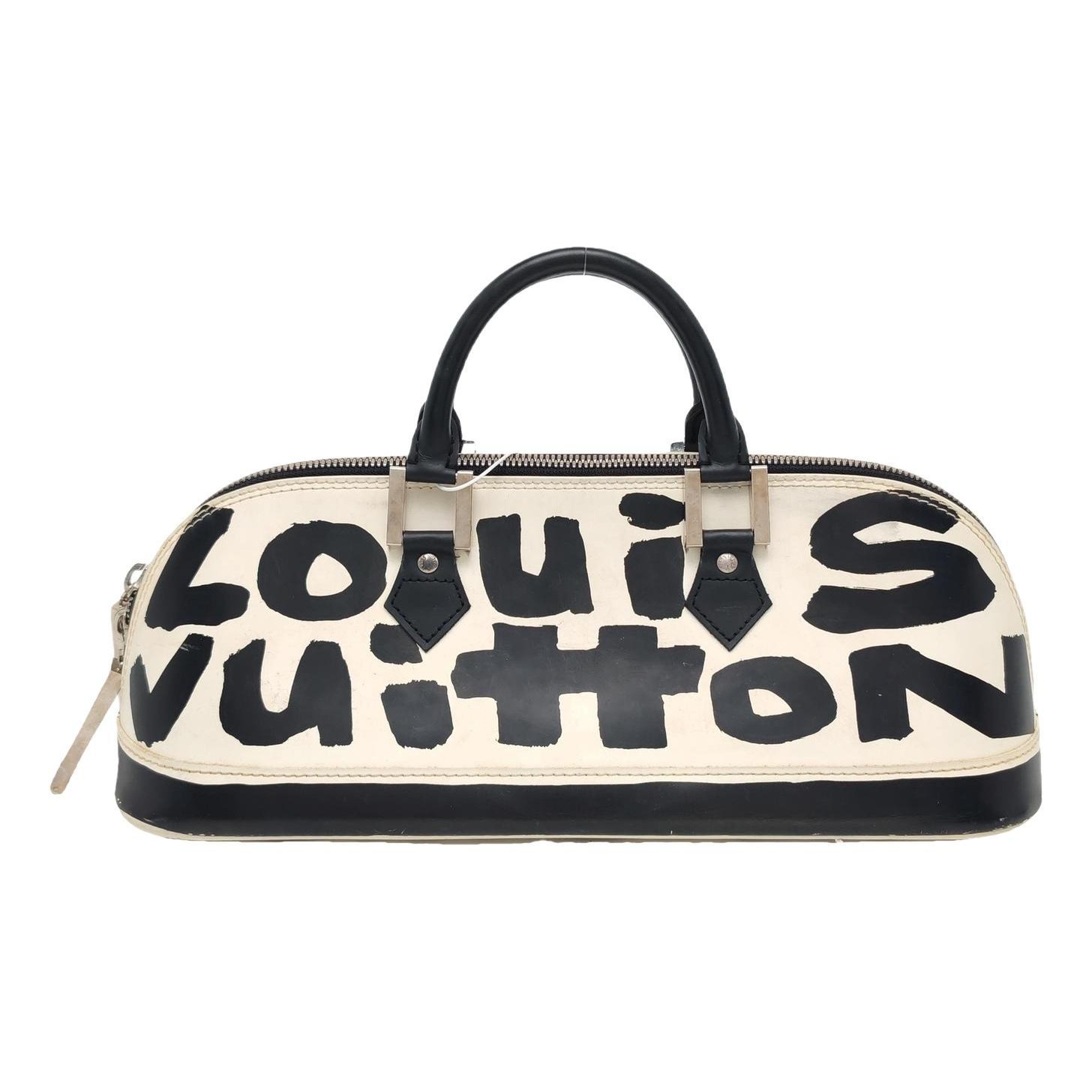 Alma patent leather handbag