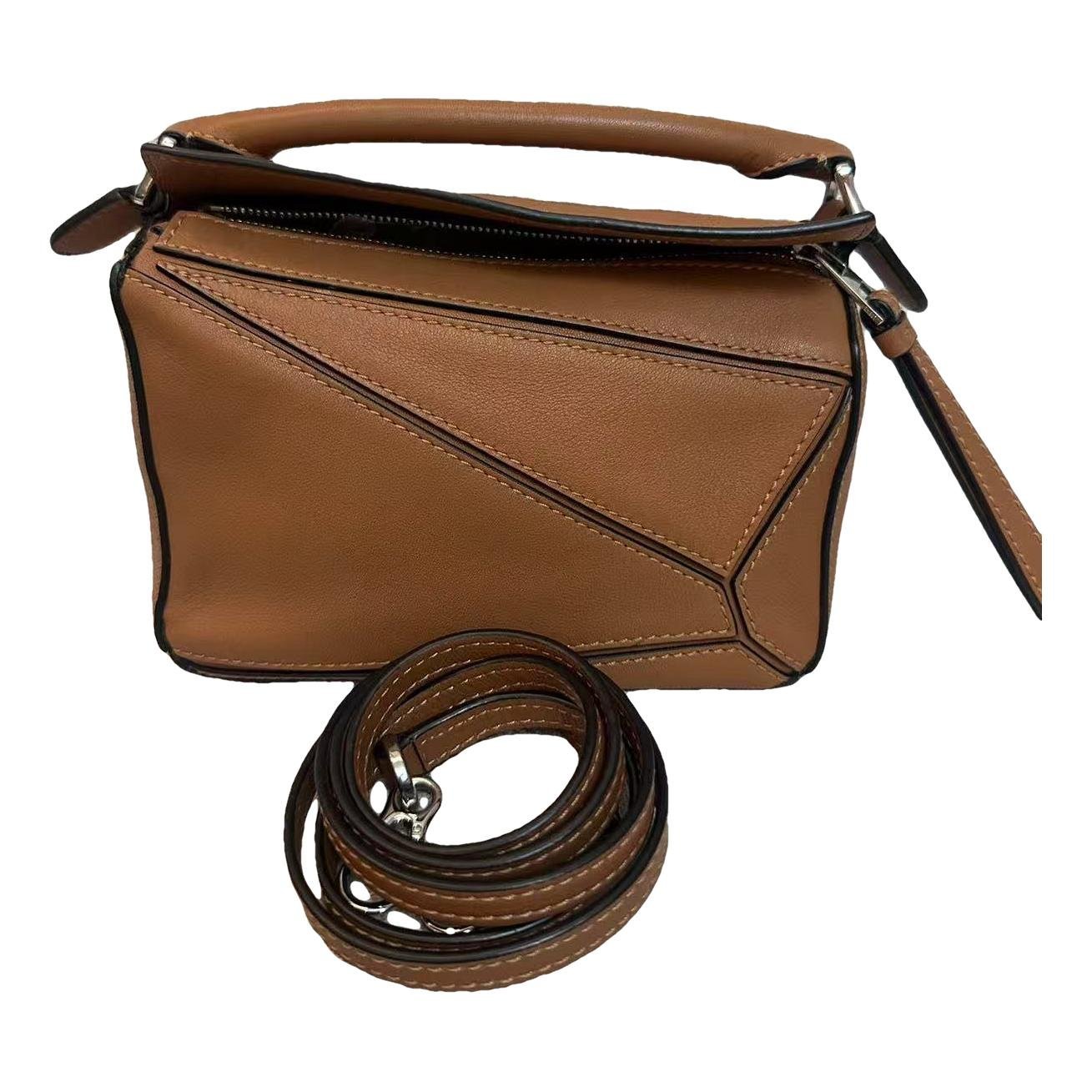 Puzzle leather handbag