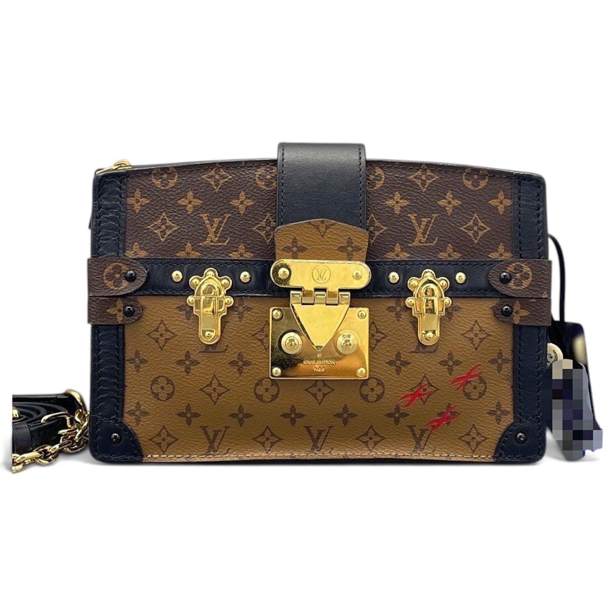 Pochette Trunk leather handbag