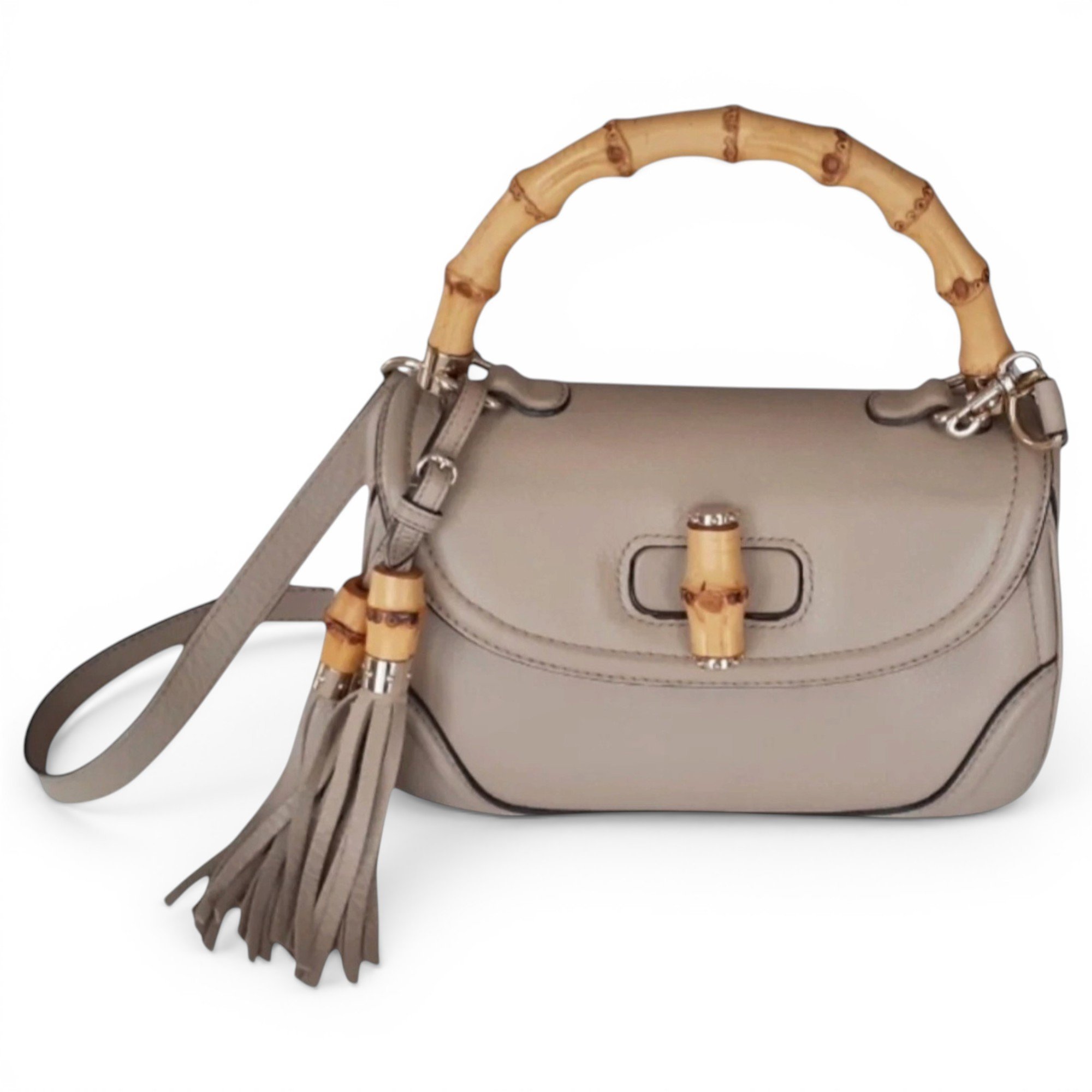 Convertible Pompon Bamboo Top Handle leather handbag