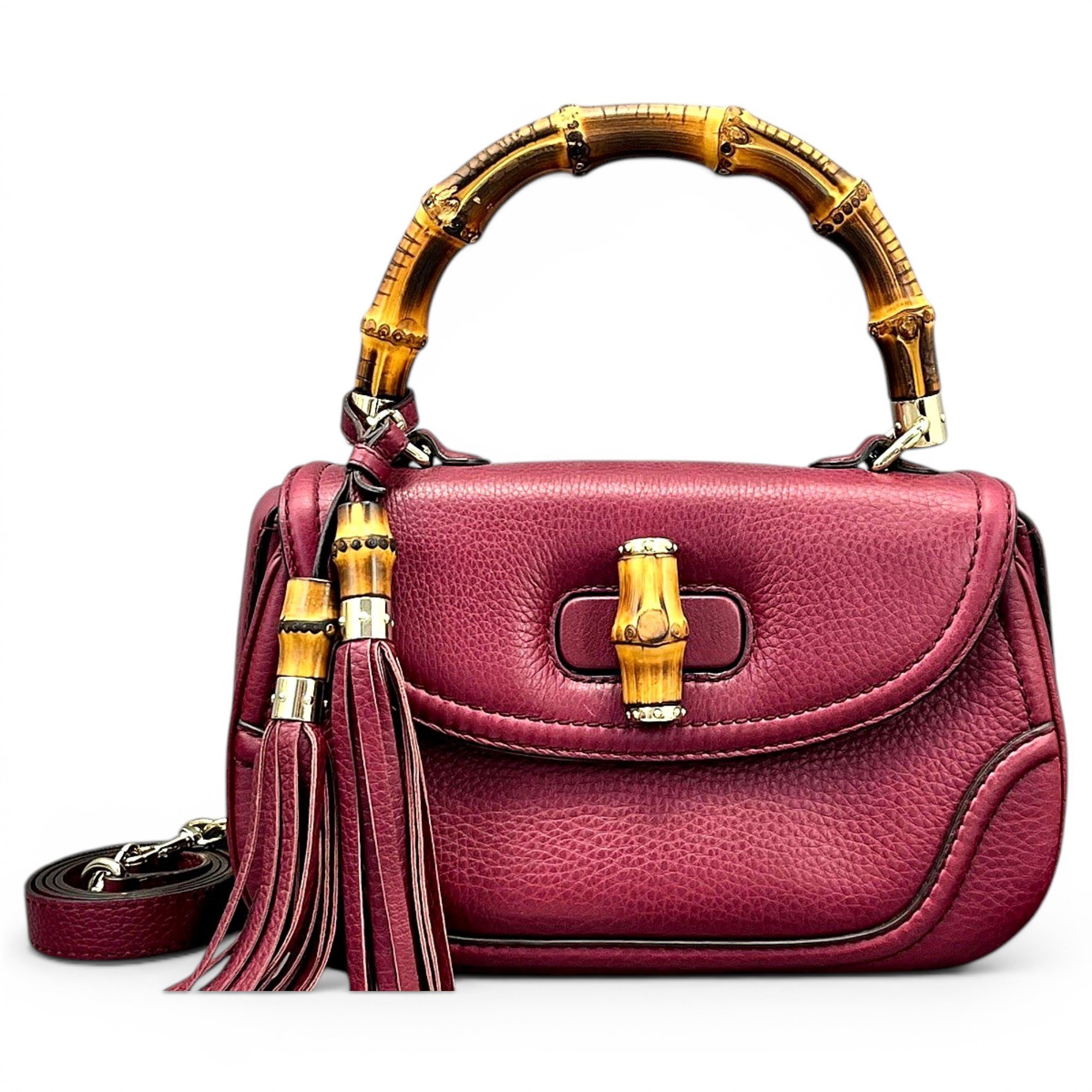 Convertible Pompon Bamboo Top Handle leather handbag