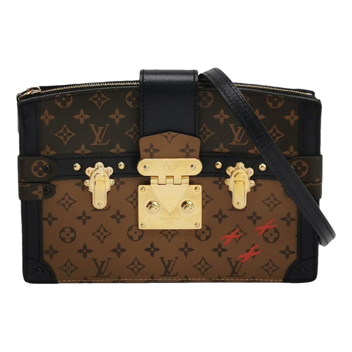 Pochette Trunk leather handbag
