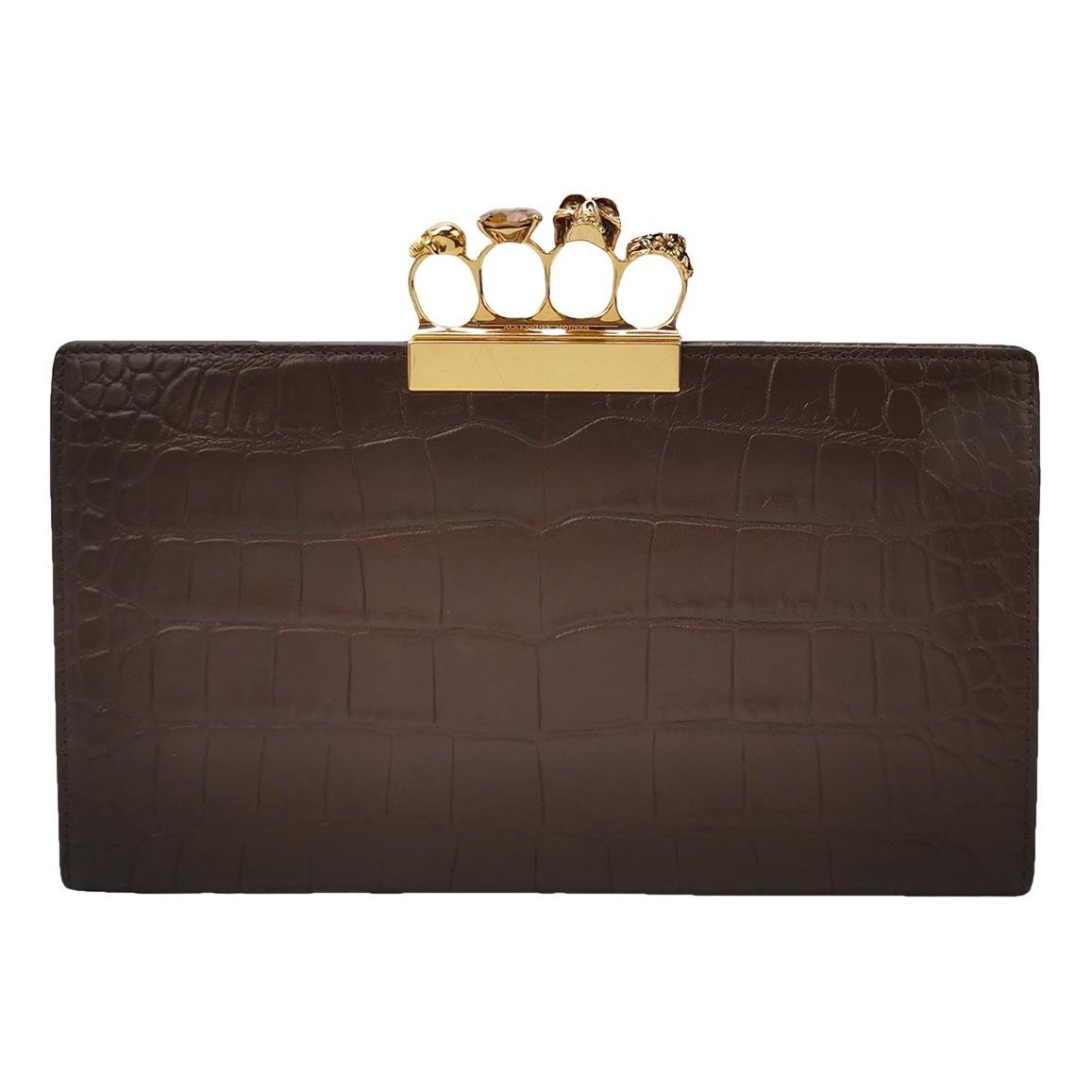 Knuckle leather clutch bag