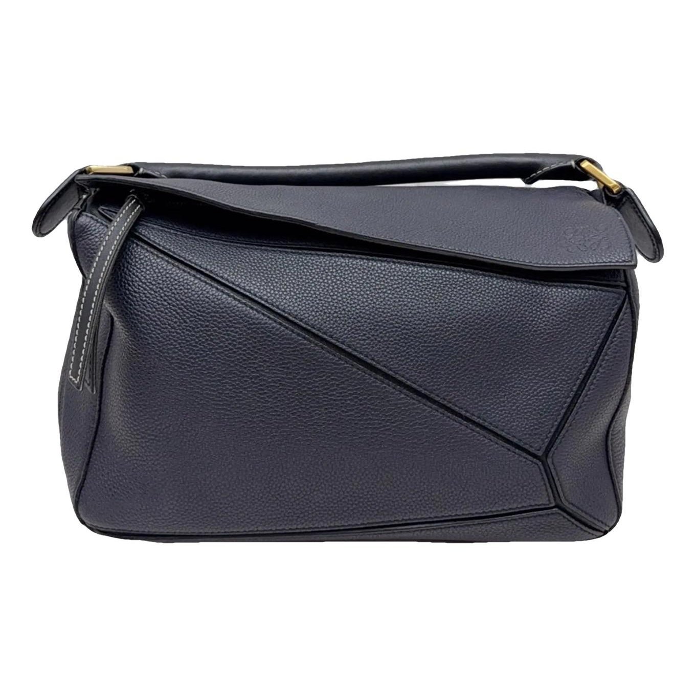 Puzzle leather handbag