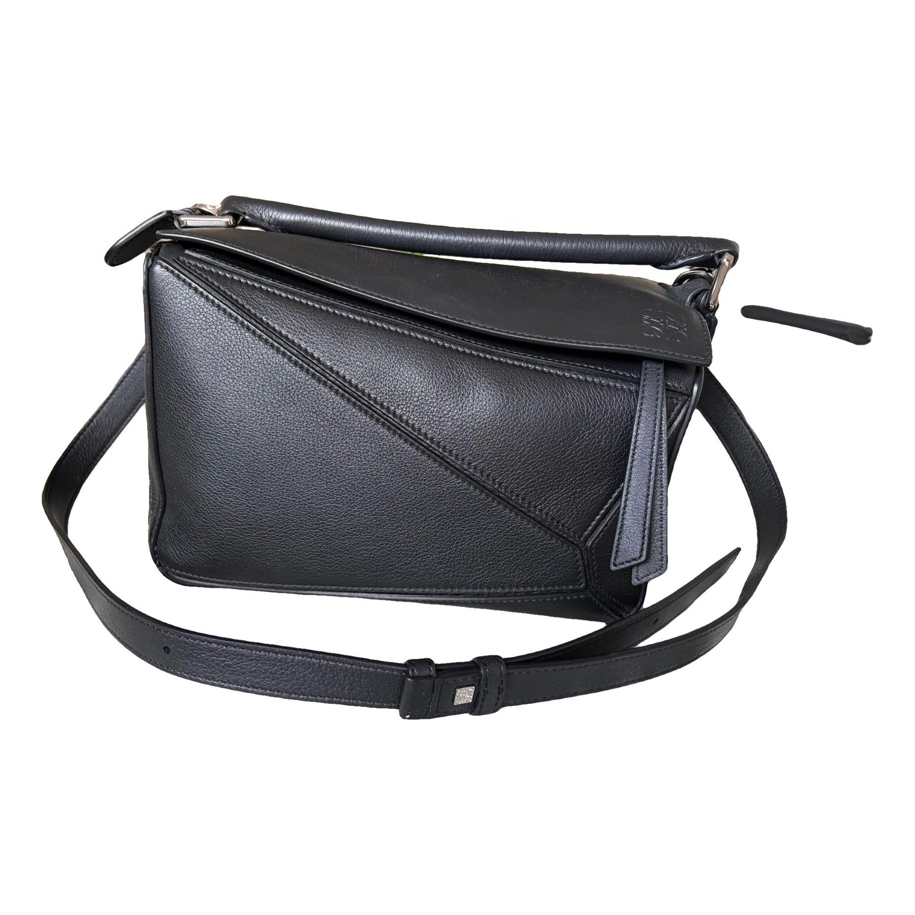 Puzzle leather handbag