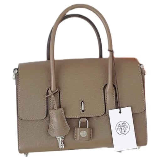 Drag leather handbag