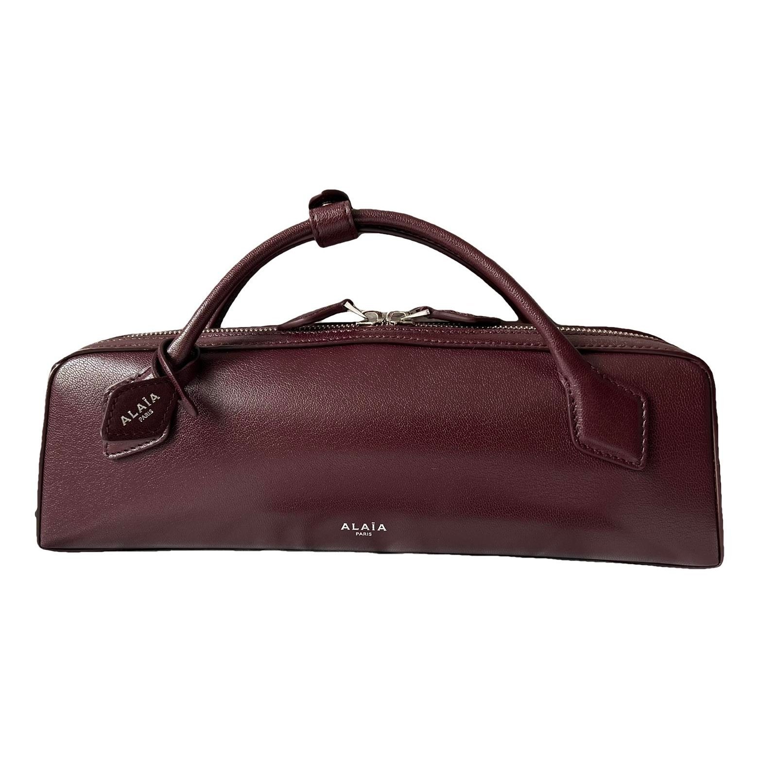 Le Teckel Clutch leather handbag
