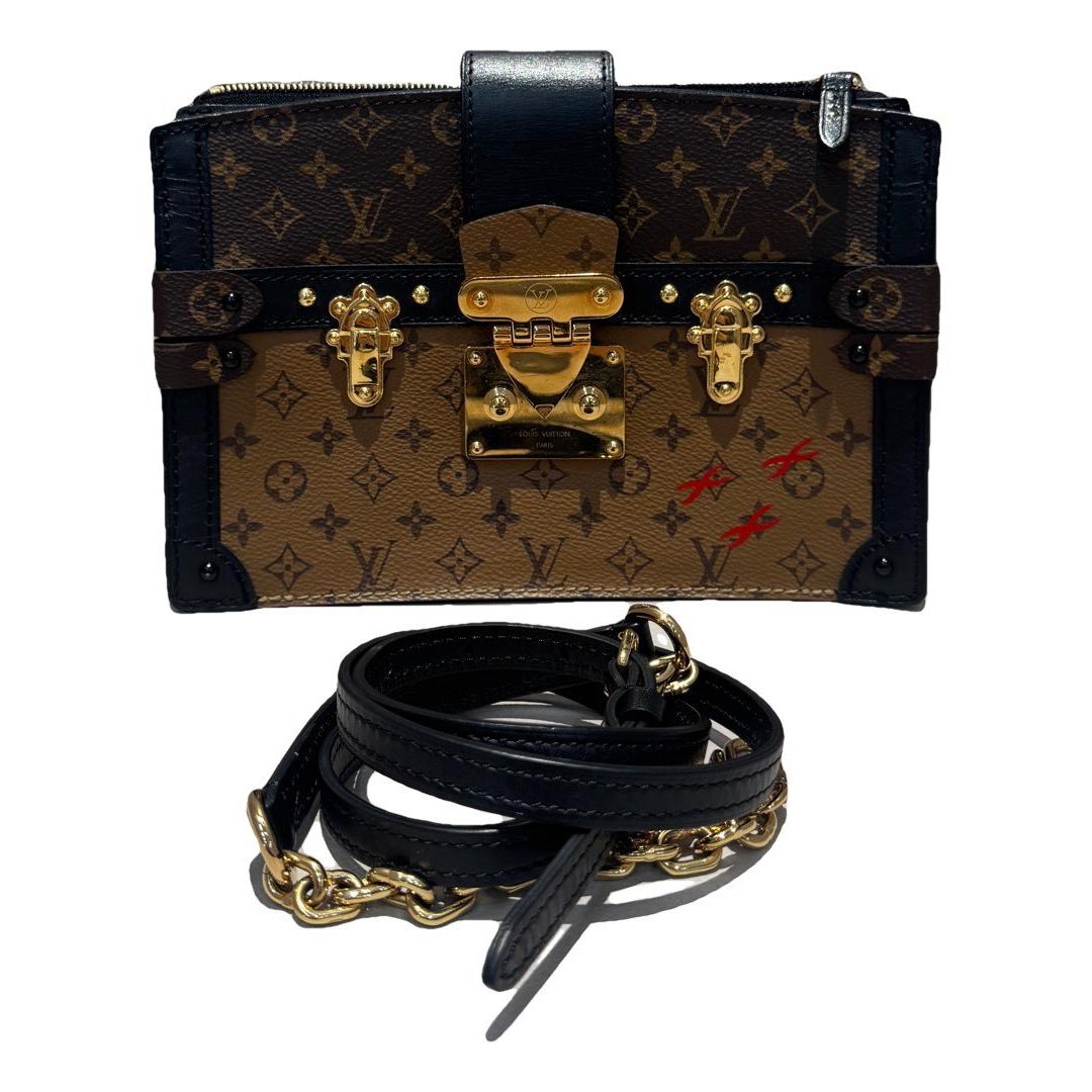 Pochette Trunk leather handbag