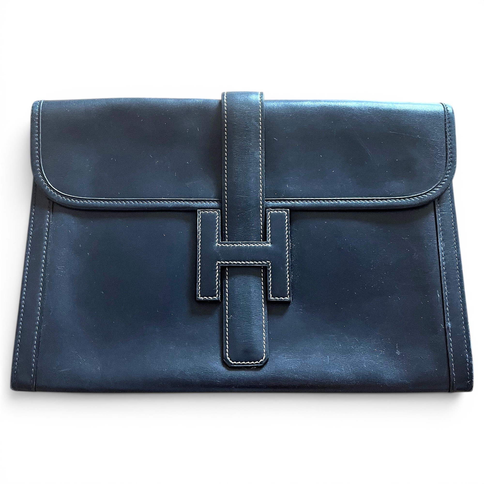 Jige leather clutch bag