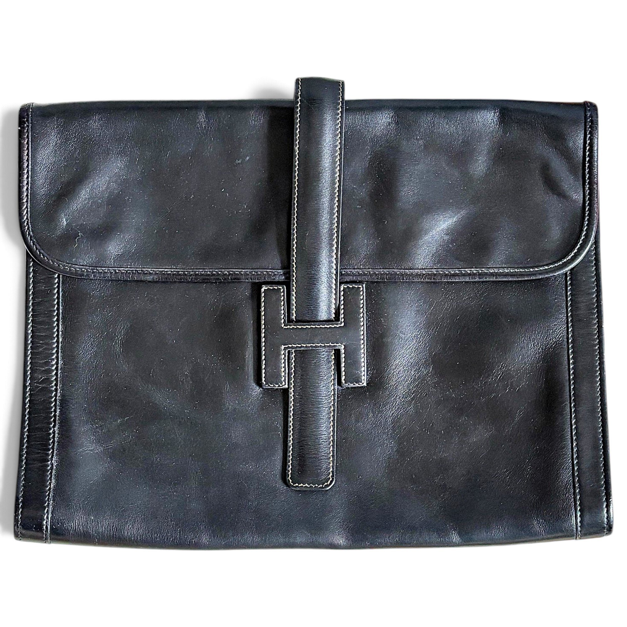 Jige leather clutch bag