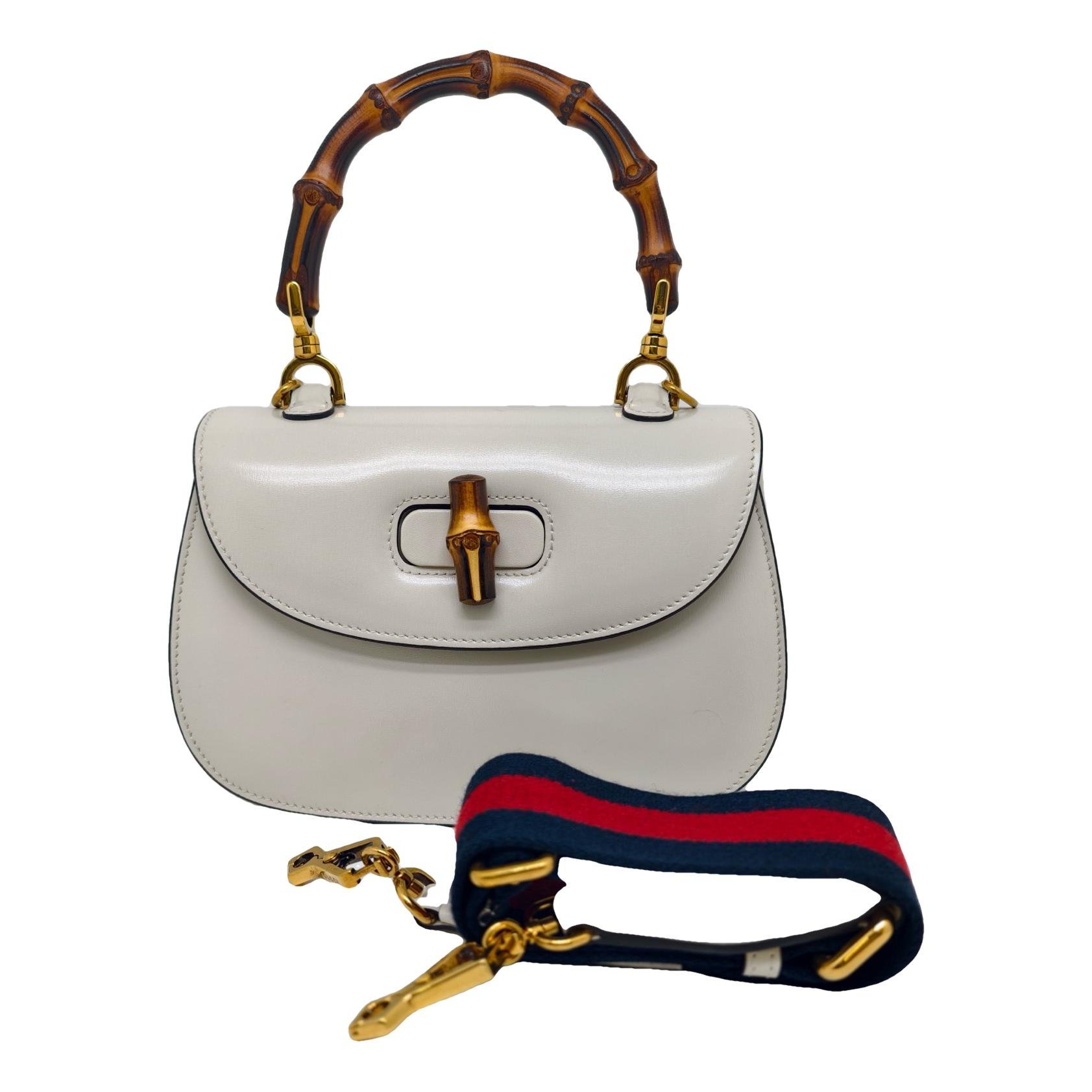 Convertible Pompon Bamboo Top Handle leather handbag
