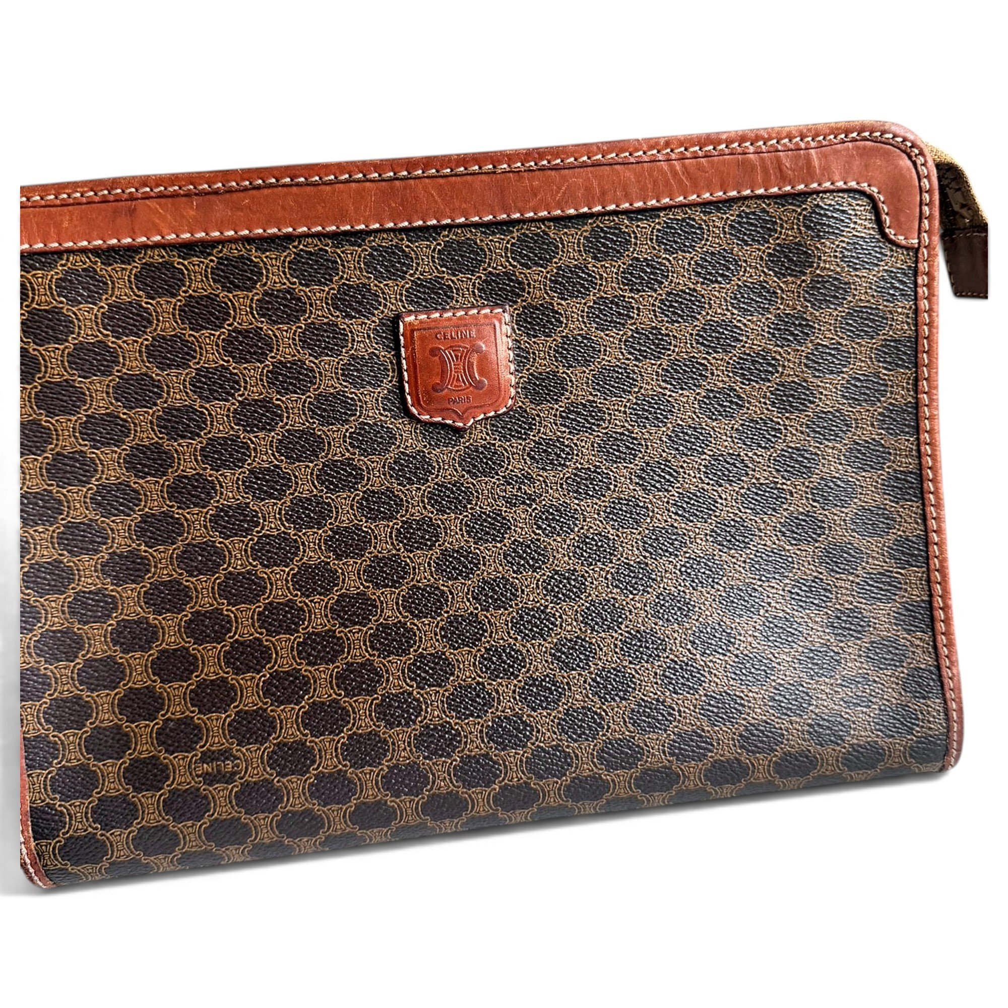 Triomphe Vintage leather clutch bag