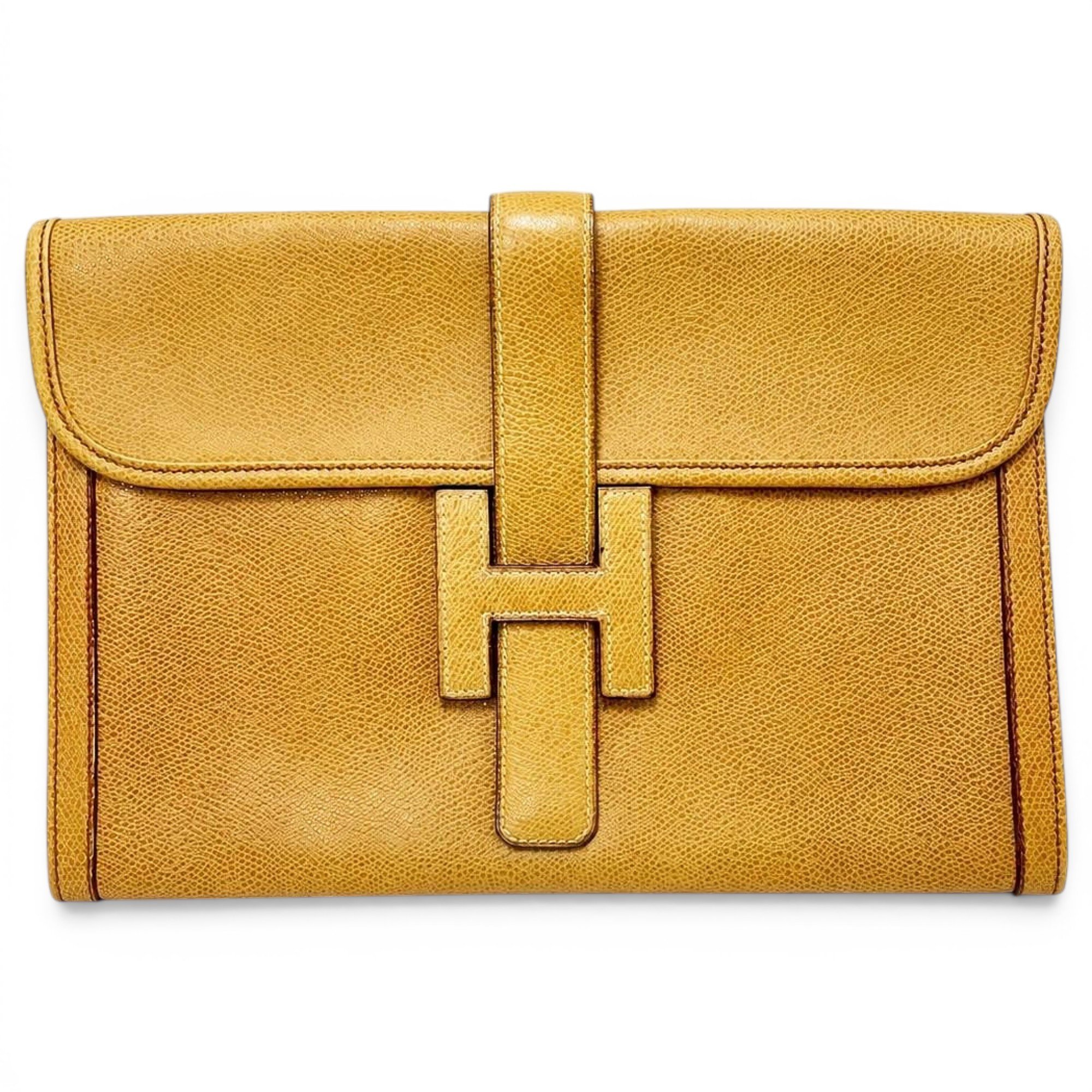 Jige leather clutch bag