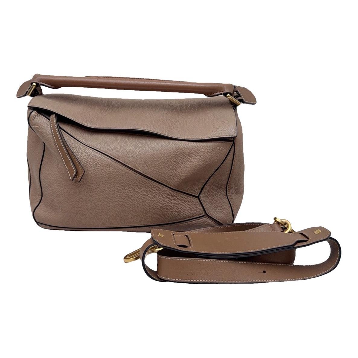 Puzzle leather handbag