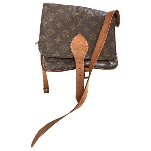 Cartouchière patent leather crossbody bag
