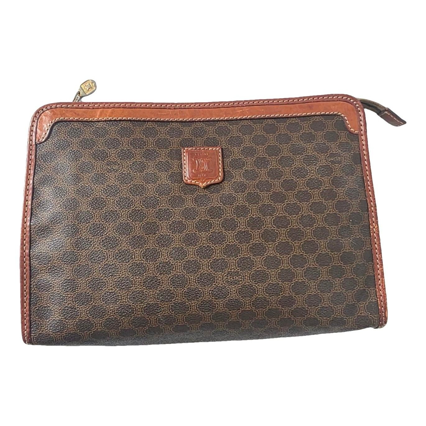 Triomphe Vintage leather clutch bag