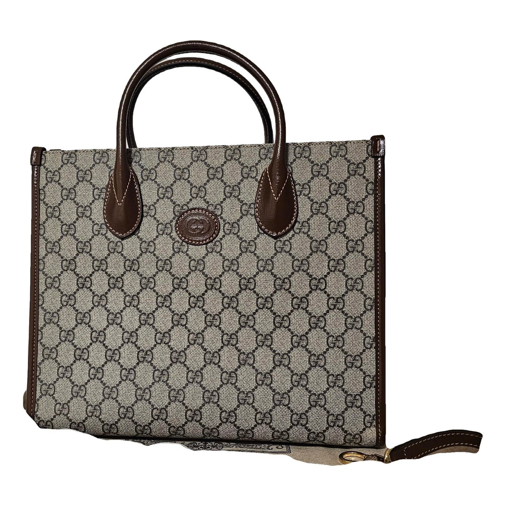 Ophidia Top Handle leather handbag