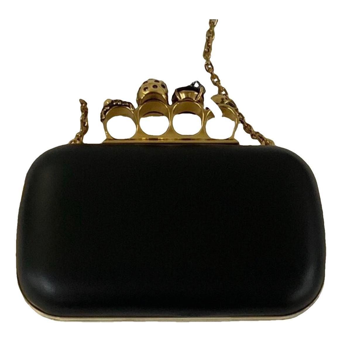 Knuckle leather clutch bag