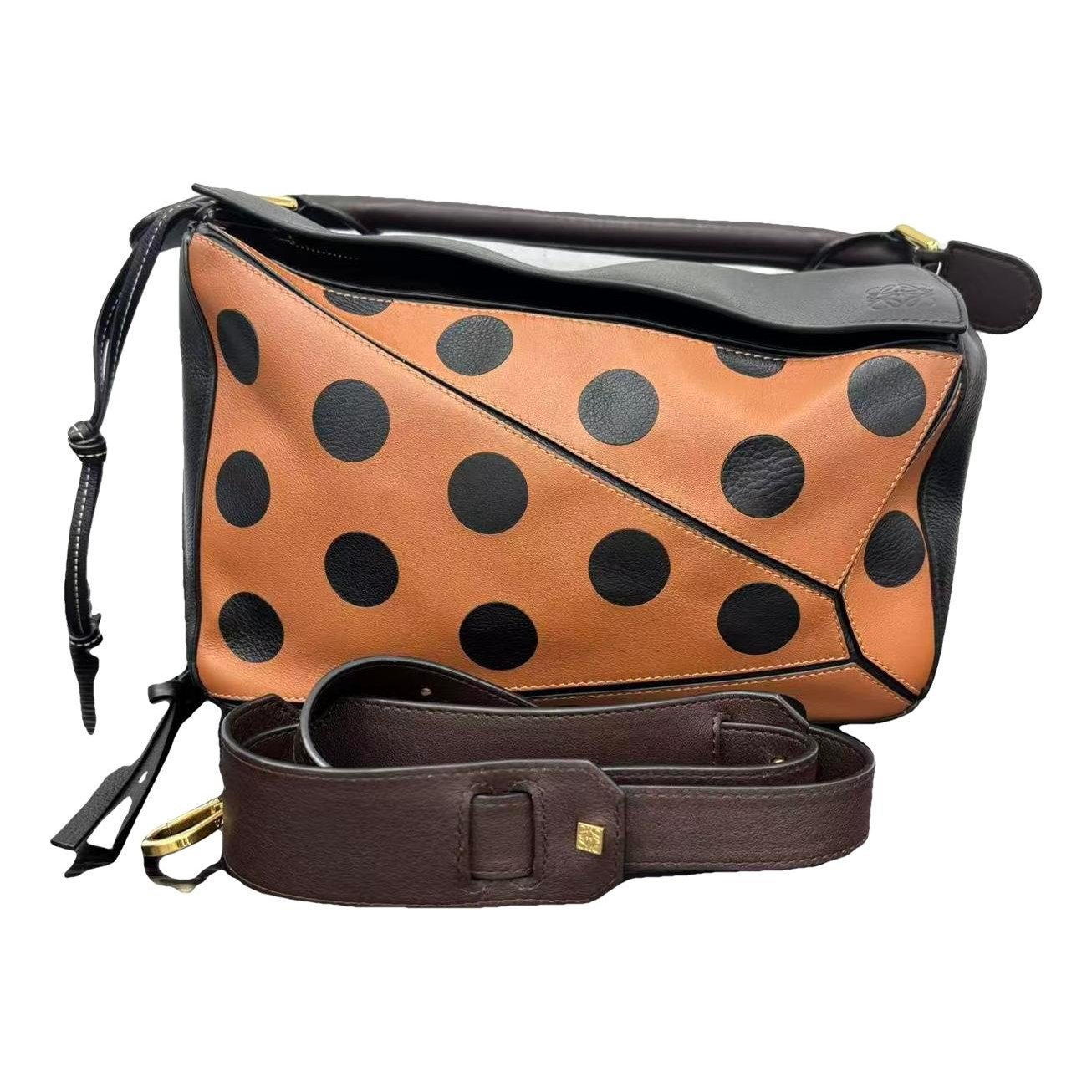 Puzzle leather handbag