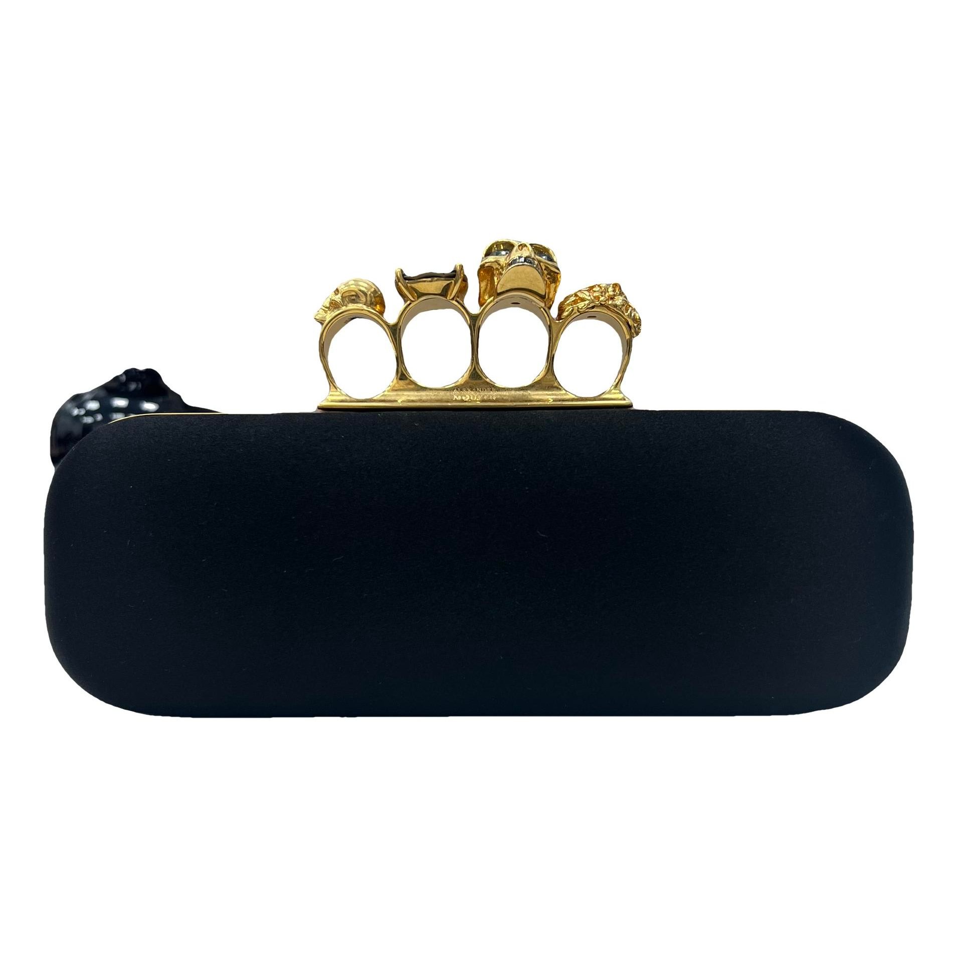 Knuckle leather clutch bag