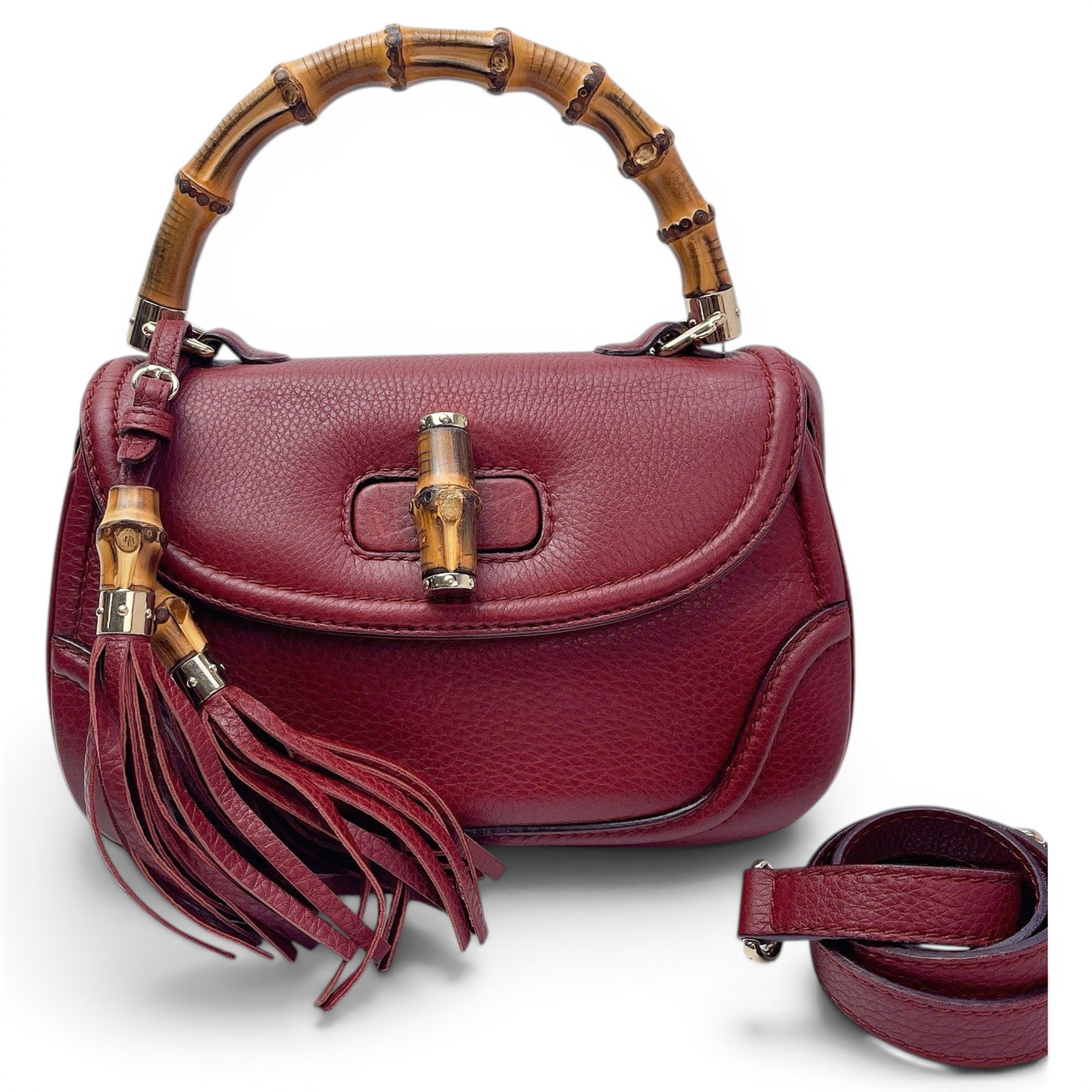 Convertible Pompon Bamboo Top Handle leather handbag