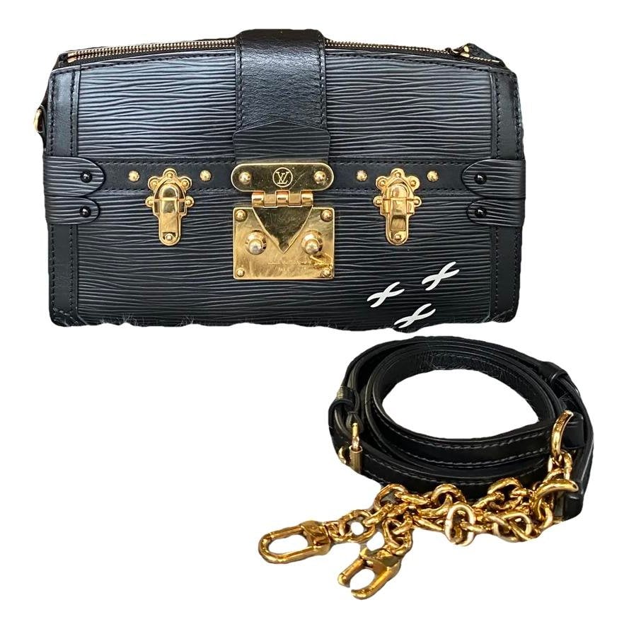 Pochette Trunk leather handbag