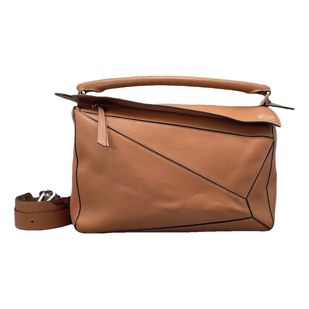 Puzzle leather handbag