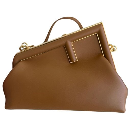 First leather handbag