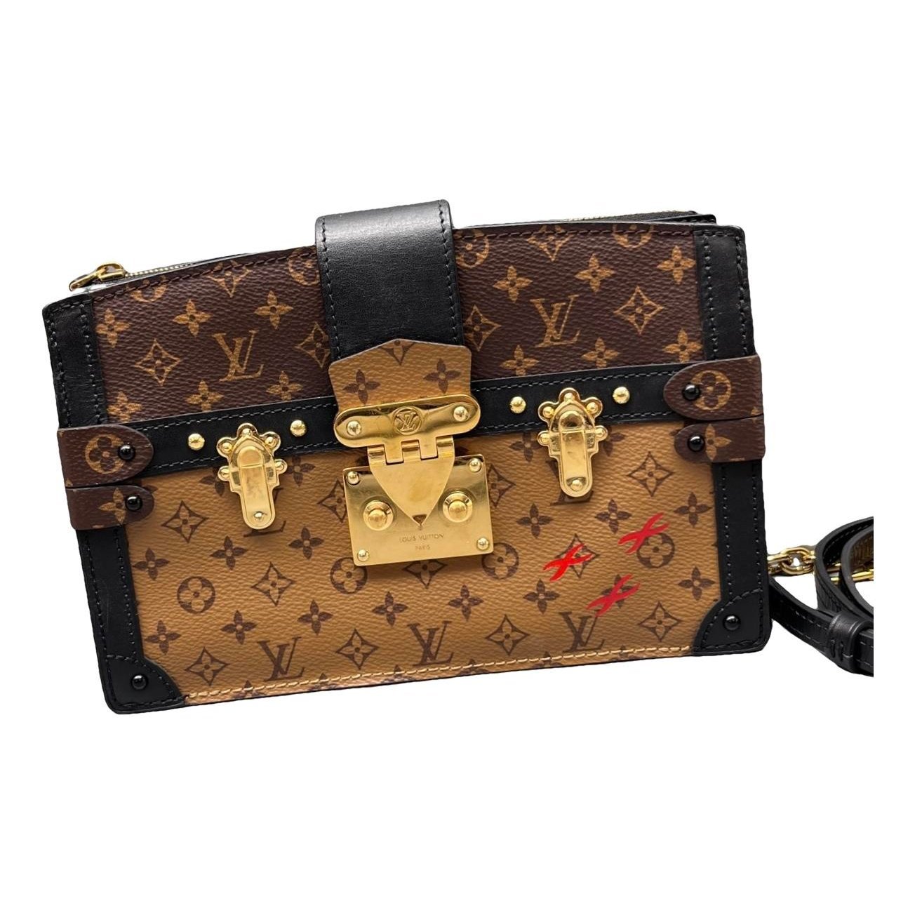 Pochette Trunk leather handbag