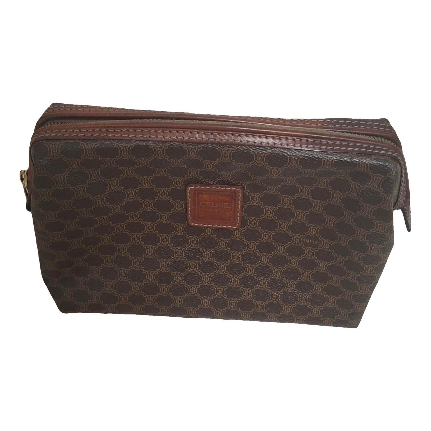 Triomphe Vintage leather clutch bag
