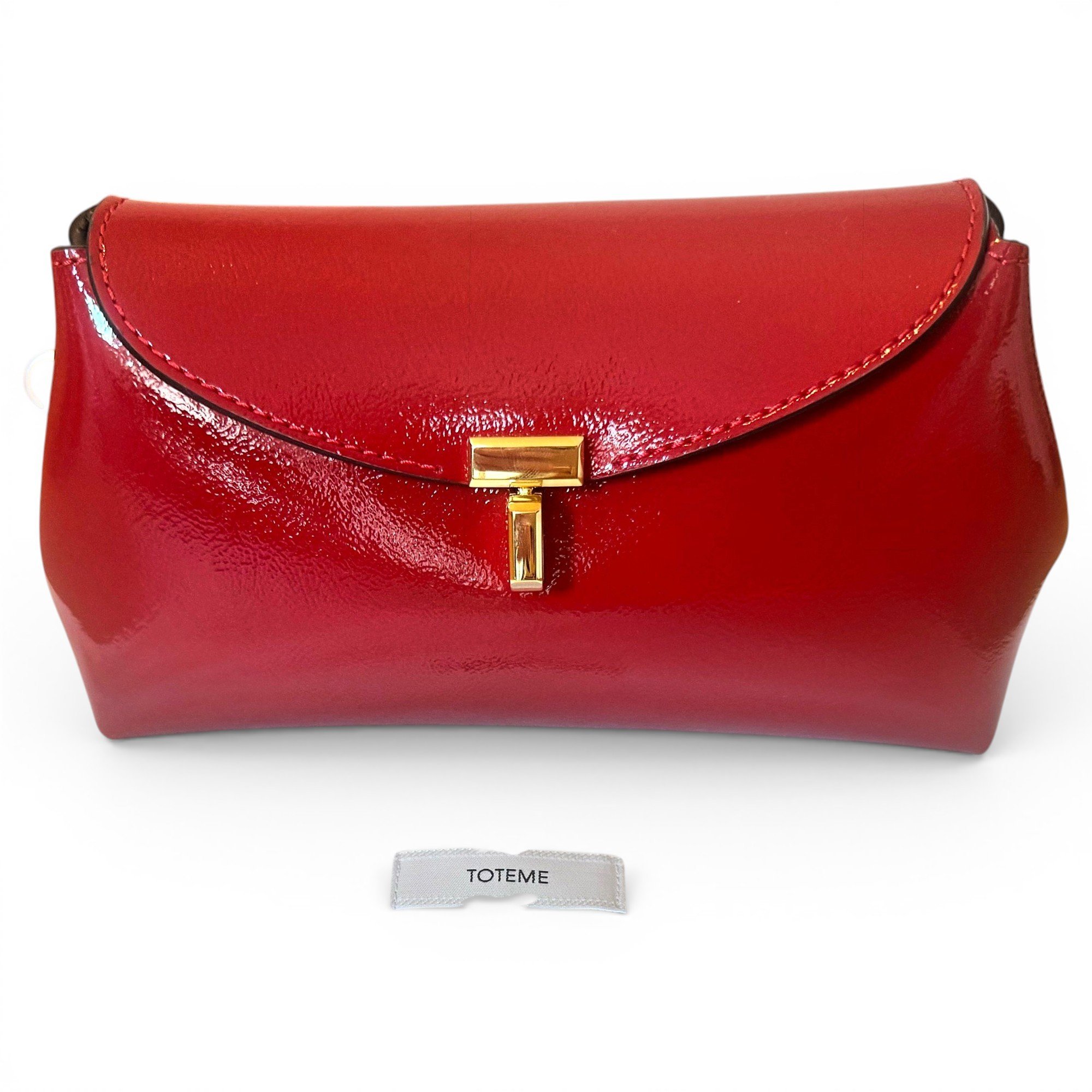 Toteme T-Lock leather clutch bag