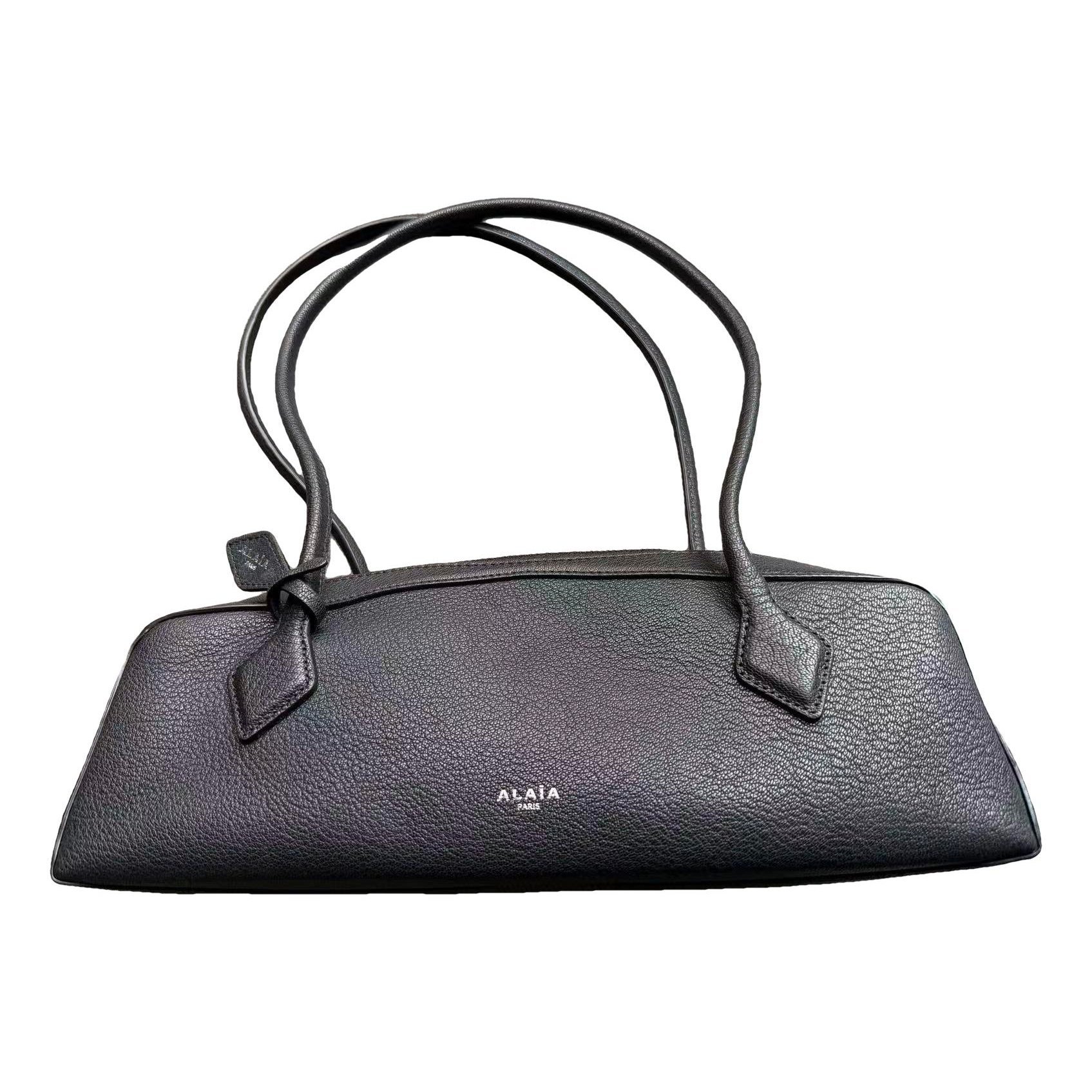 Le Teckel leather handbag