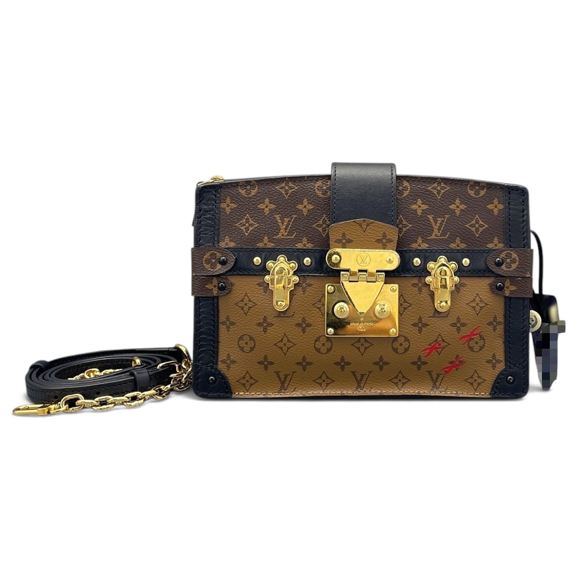 Pochette Trunk leather handbag