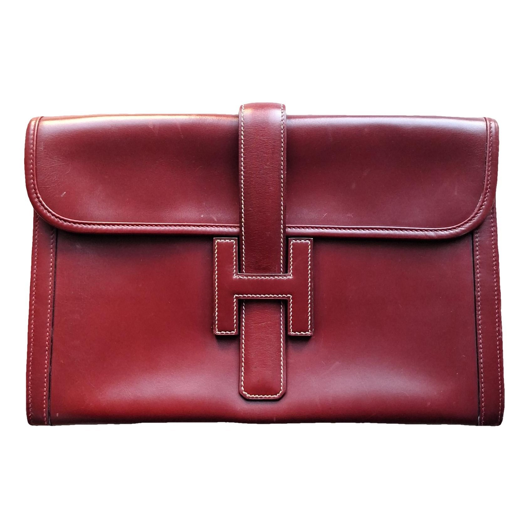 Jige leather clutch bag