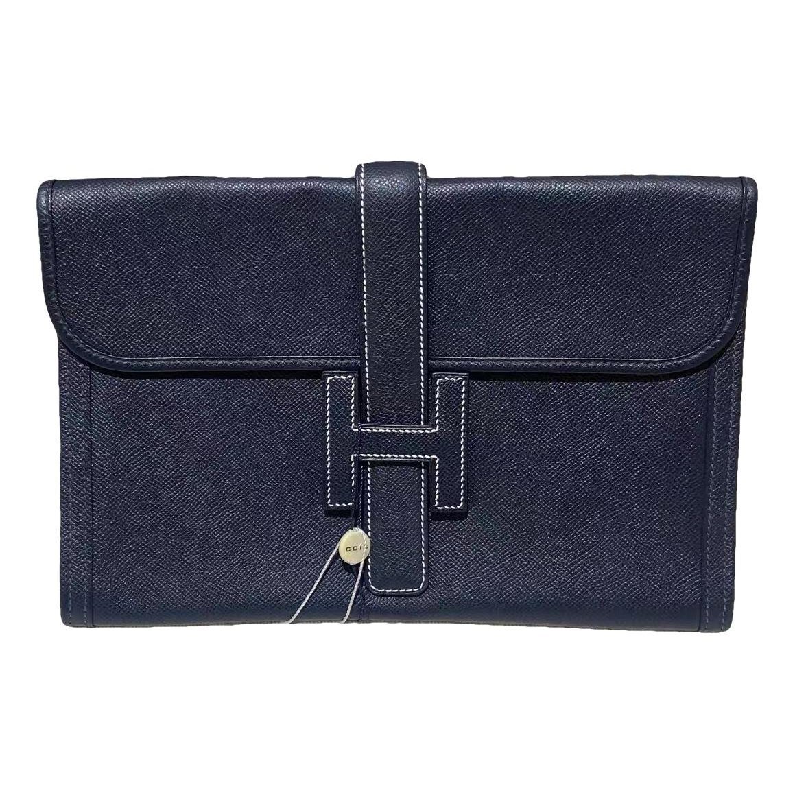 Jige leather clutch bag