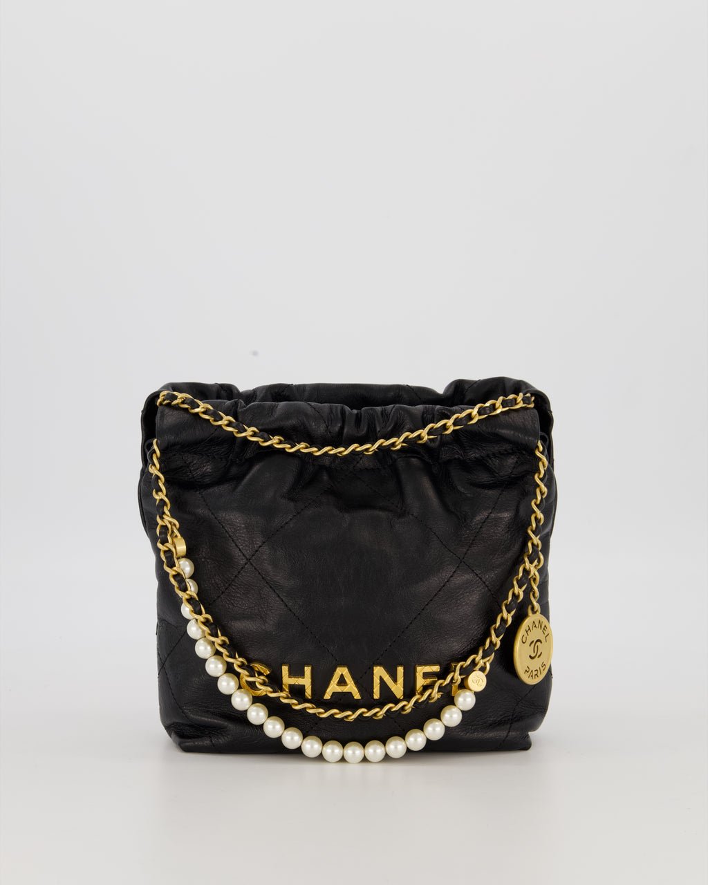 Chanel Mini 22 Bag in Black Calfskin Leather with Gold Hardware and Pearl Detail on Strap