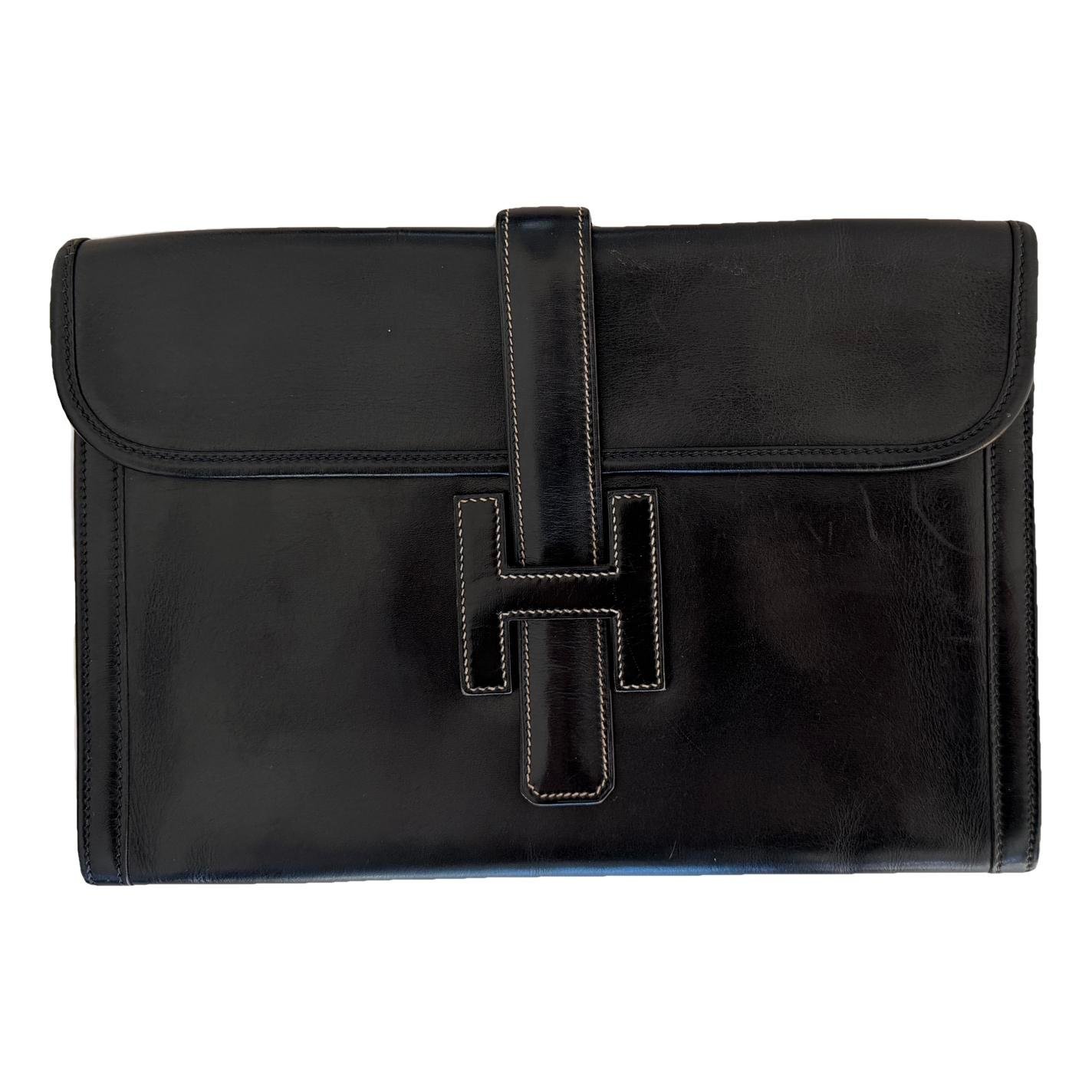 Jige leather clutch bag