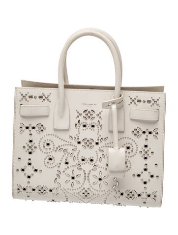 Leather This is a White Leather Studded Bandana Baby Sac de Jour Small