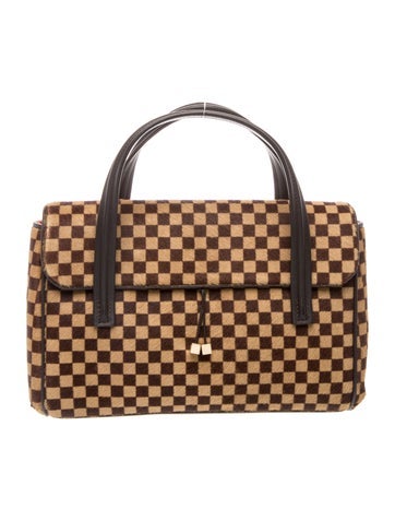Damier Ebene Sauvage Lionne