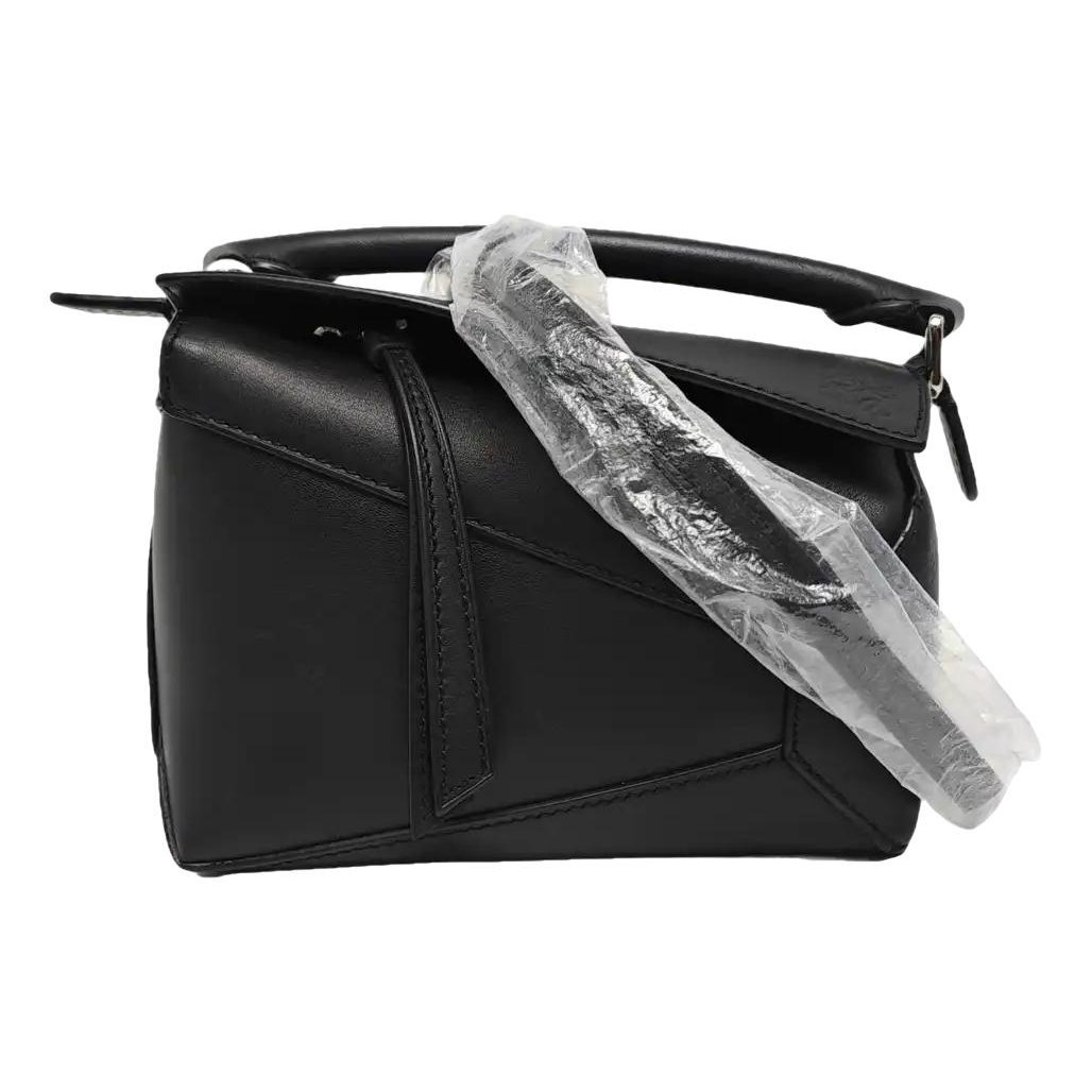 Puzzle leather handbag