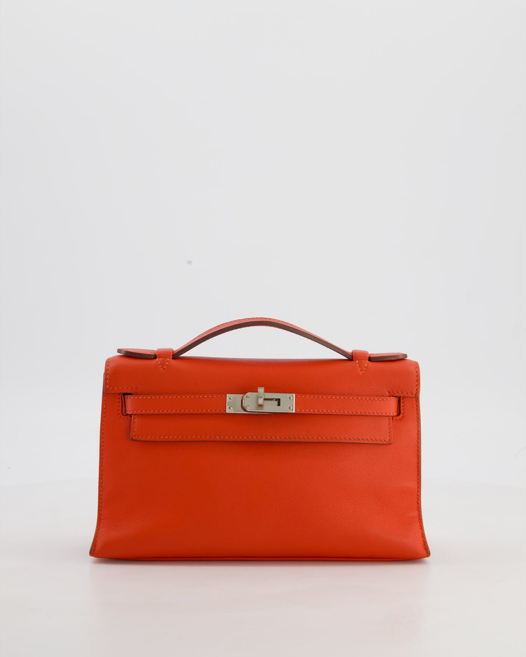 Hermès Kelly Pochette Bag in Capucine Swift Leather with Palladium Hardware