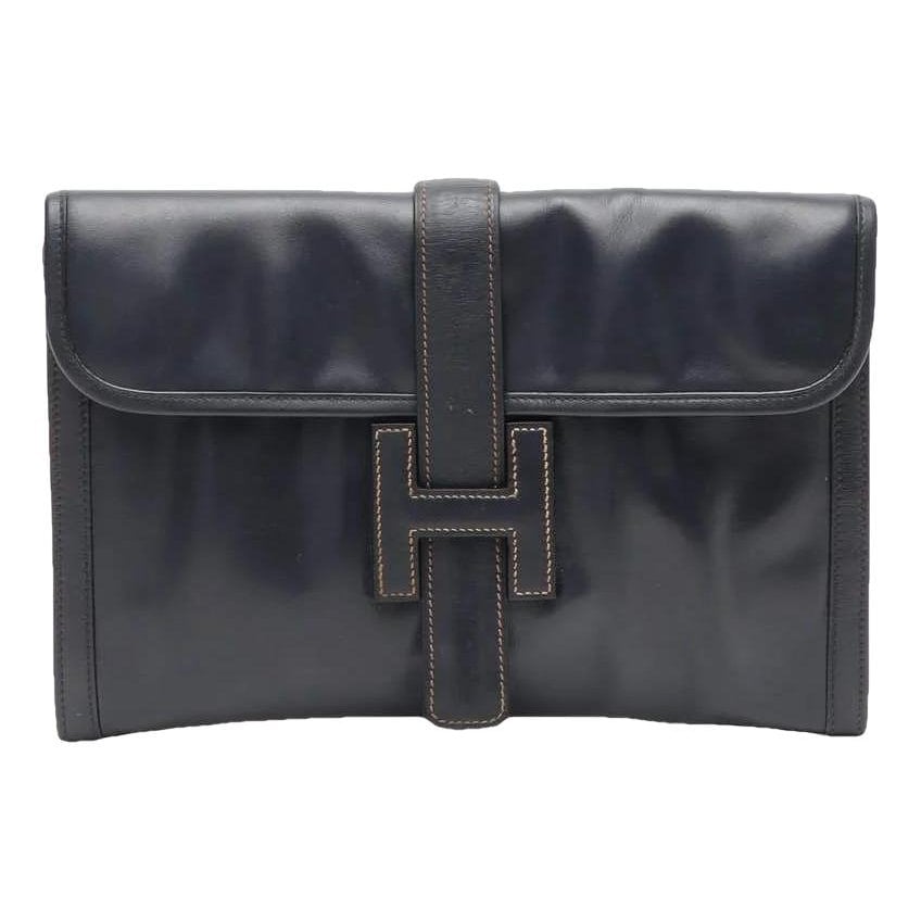 Jige leather clutch bag